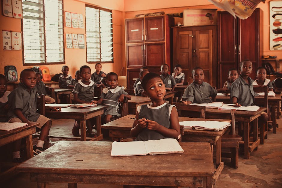 African children attentively participating in a classroom lesson, fostering education and learning